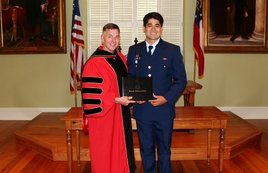 Alberto Raymond Receiving Diploma from GMC