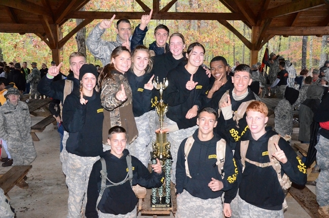 2015 National Raider Champions GMC Mixed Team Poses with Trophy.